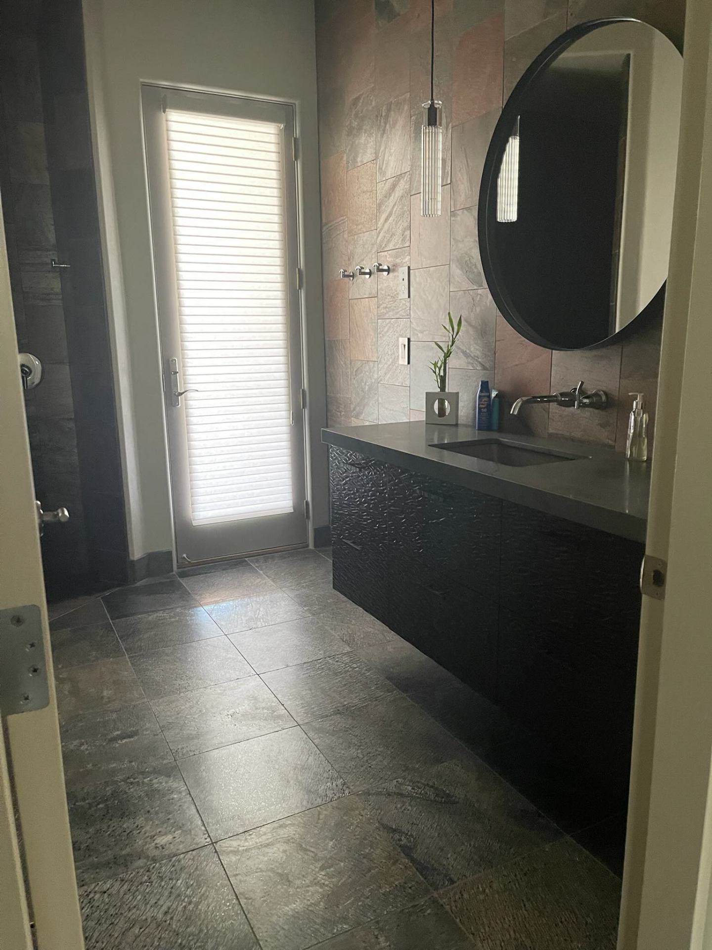 Modern powder room with slate tile floor