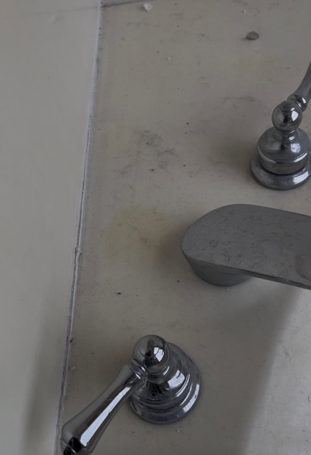 Tub faucet & handles — before professional cleaning